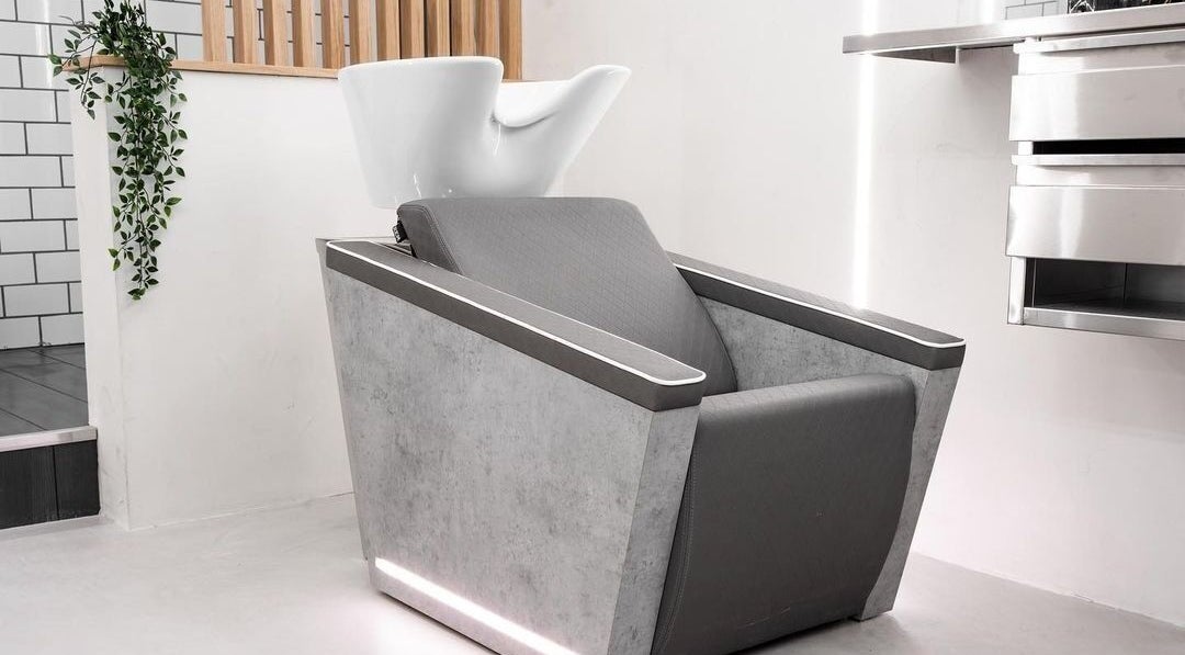 Modern hair wash station at Move Salon Inchicore, Dublin, County Dublin, IE, featuring sleek lines and gray tones.