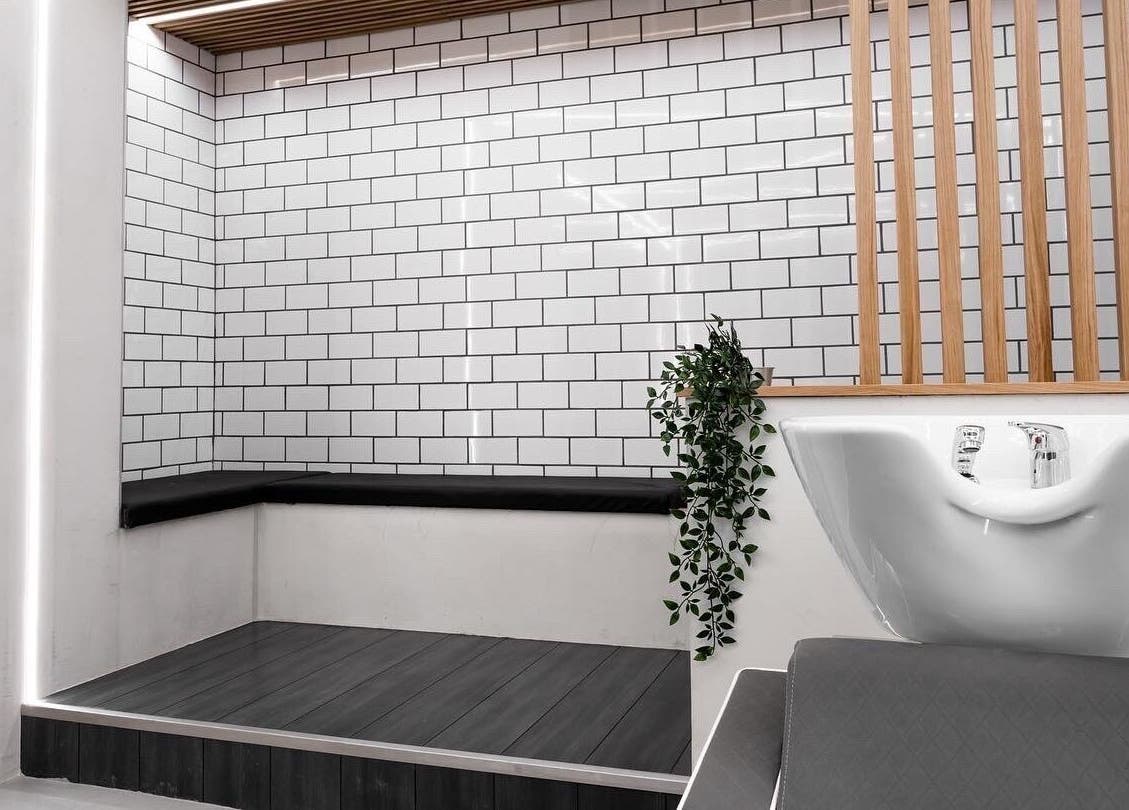 Modern wash area at Move Salon Inchicore, Dublin, County Dublin, IE, with stylish tiles and leafy decor.