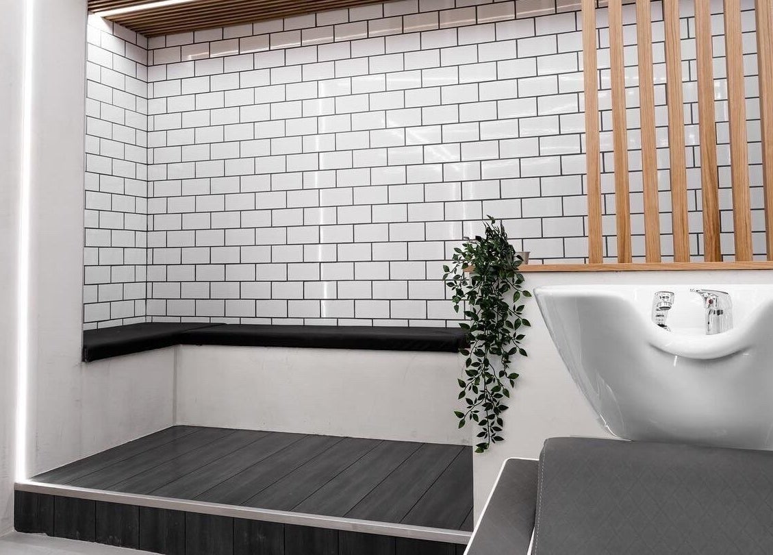 Modern wash area at Move Salon Inchicore, Dublin, County Dublin, IE, with stylish tiles and leafy decor.