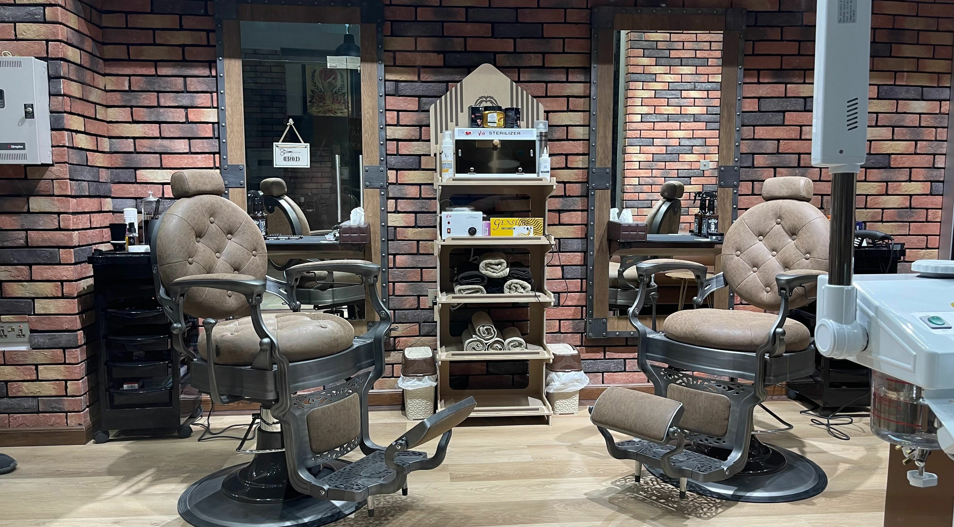 Elegant barber chairs at Gentsy Barber Shop in Dubai, AE, showcasing a stylish and comfortable grooming environment.