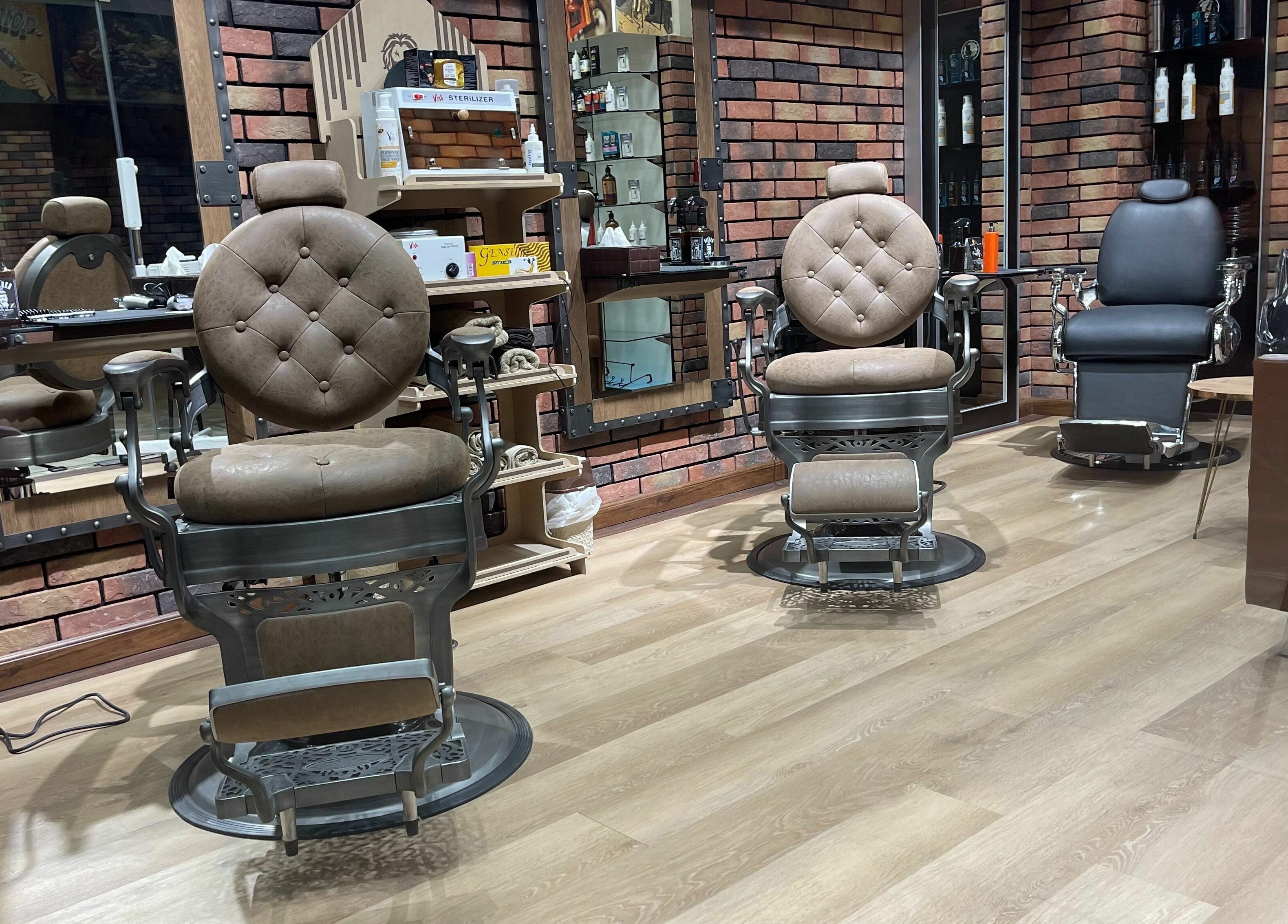 Classic barber chairs at Gentsy Barber Shop, Dubai, AE, showcasing luxury and comfort.