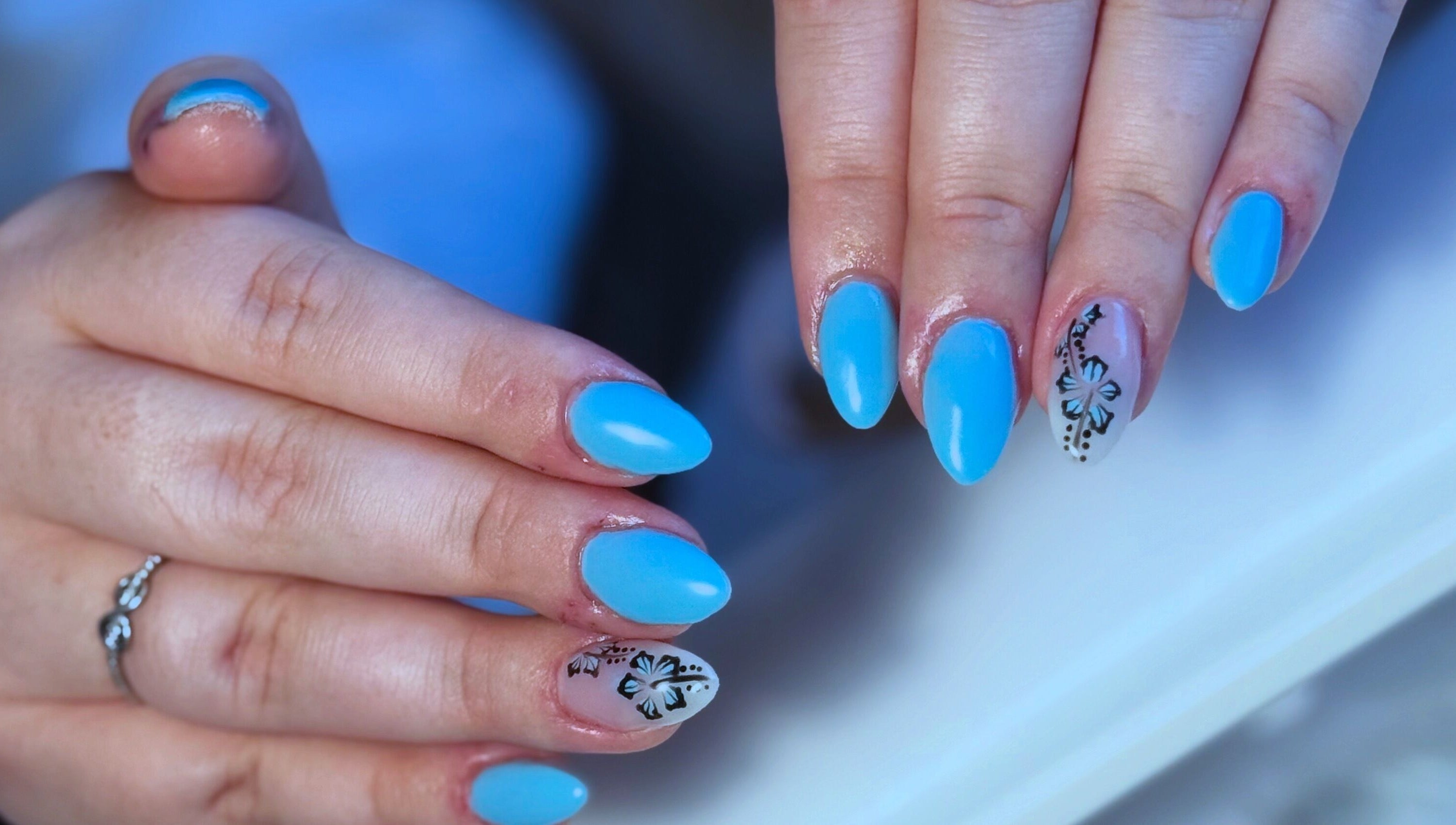 Elegant blue nails with floral art at Elegance in Bloom Co., Ellenbrook, Western Australia, AU.