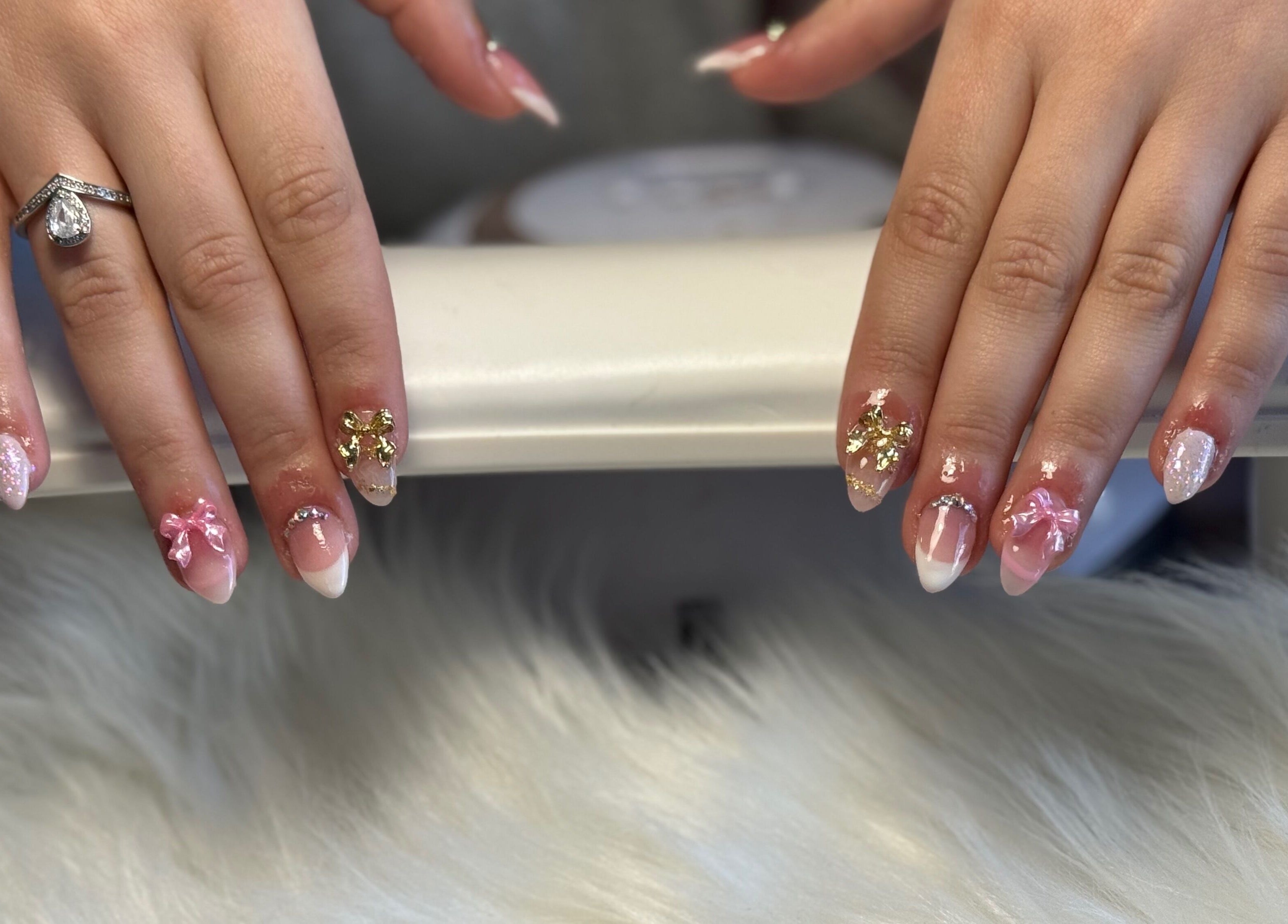 Intricate nail art with bows and gold accents at Elegance in Bloom Co., Ellenbrook, Western Australia, AU.