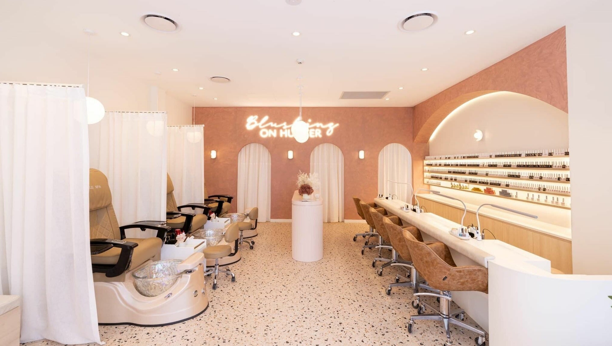 Elegant interior of Blushing on Hunter, Newcastle, NSW, AU showcasing modern spa pedicure stations.
