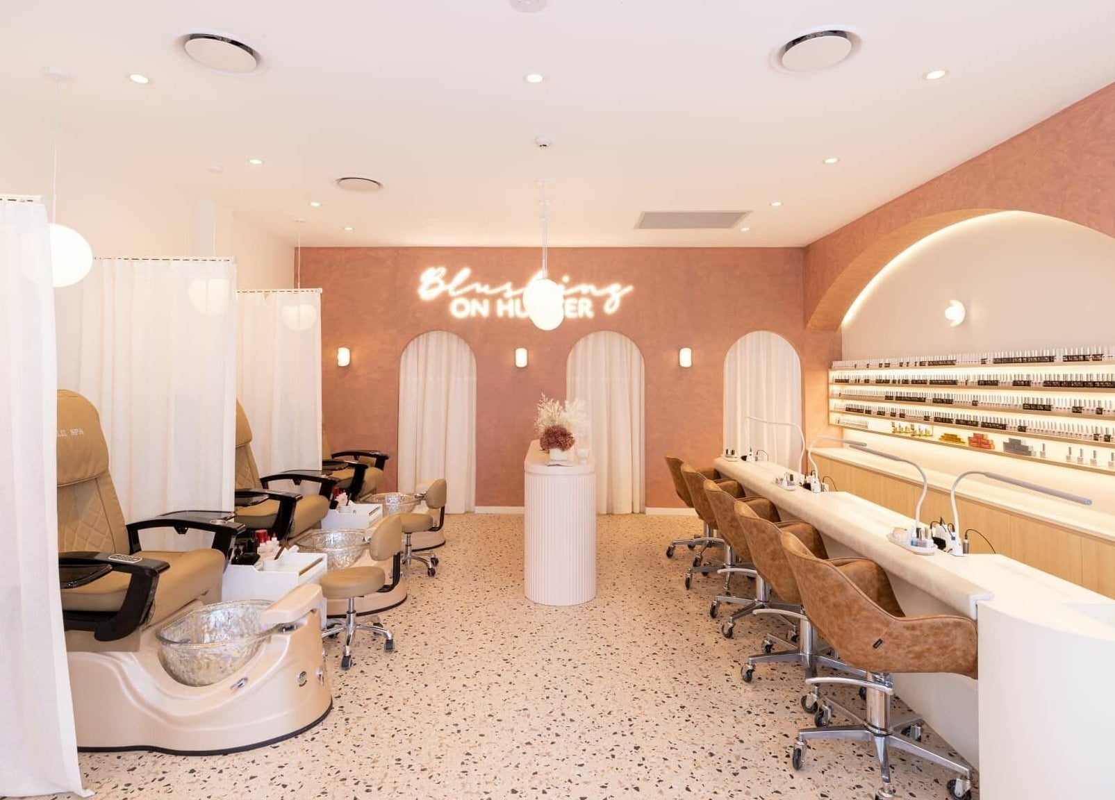 Elegant interior of Blushing on Hunter, Newcastle, NSW, AU showcasing modern spa pedicure stations.