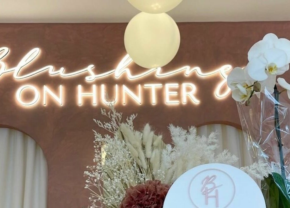 Stylish neon sign and floral decor at Blushing on Hunter, Newcastle, New South Wales, AU.