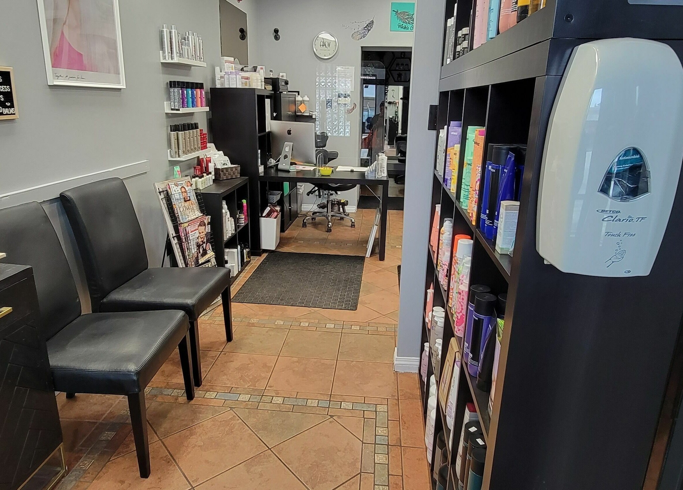 Interior of Visible Changes Hair Design in Calgary, Alberta, CA, showcasing stylish decor and product shelves.