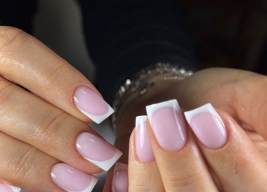 Close-up of elegant French manicured nails at Beauty Zone by YZ in Port Moody, British Columbia, CA.