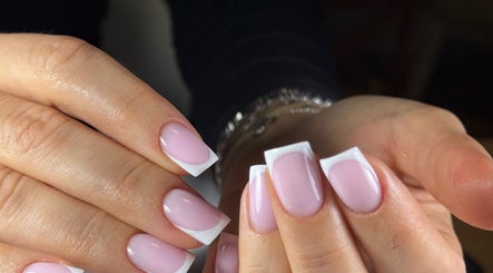 Close-up of elegant French manicured nails at Beauty Zone by YZ in Port Moody, British Columbia, CA.