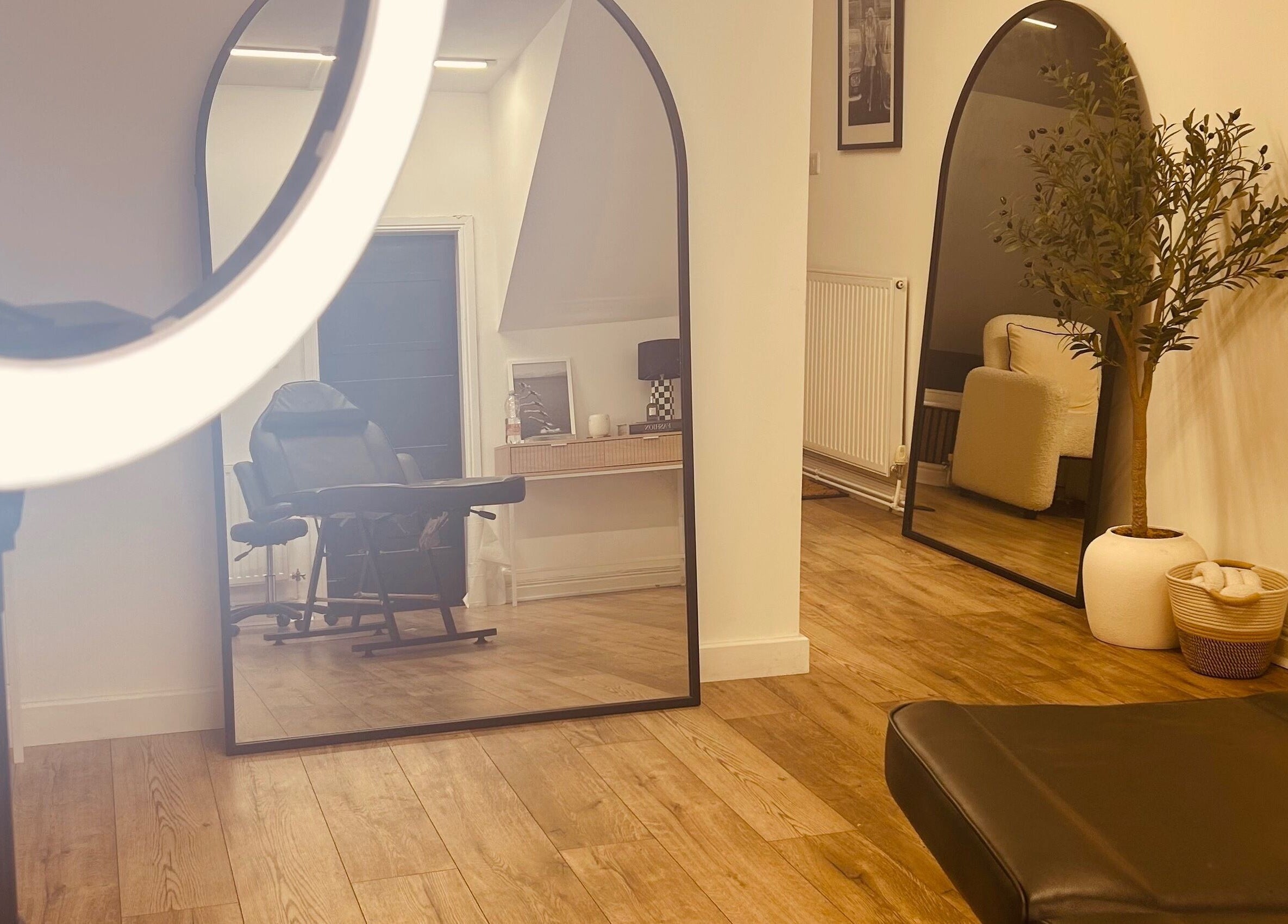 Interior of LJ SKIN & AESTHETICS CLINIC in Oswestry, England, GB with mirrors and stylish decor.