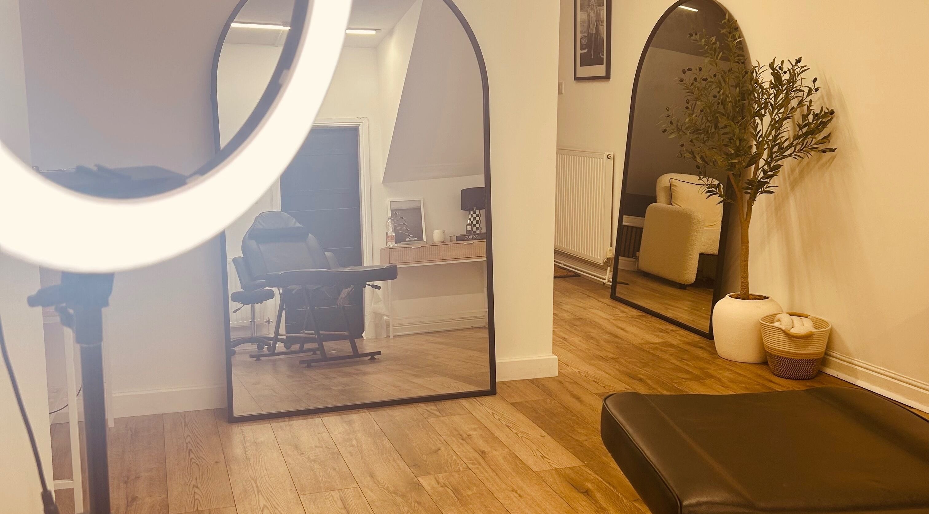 Interior of LJ SKIN & AESTHETICS CLINIC in Oswestry, England, GB with mirrors and stylish decor.