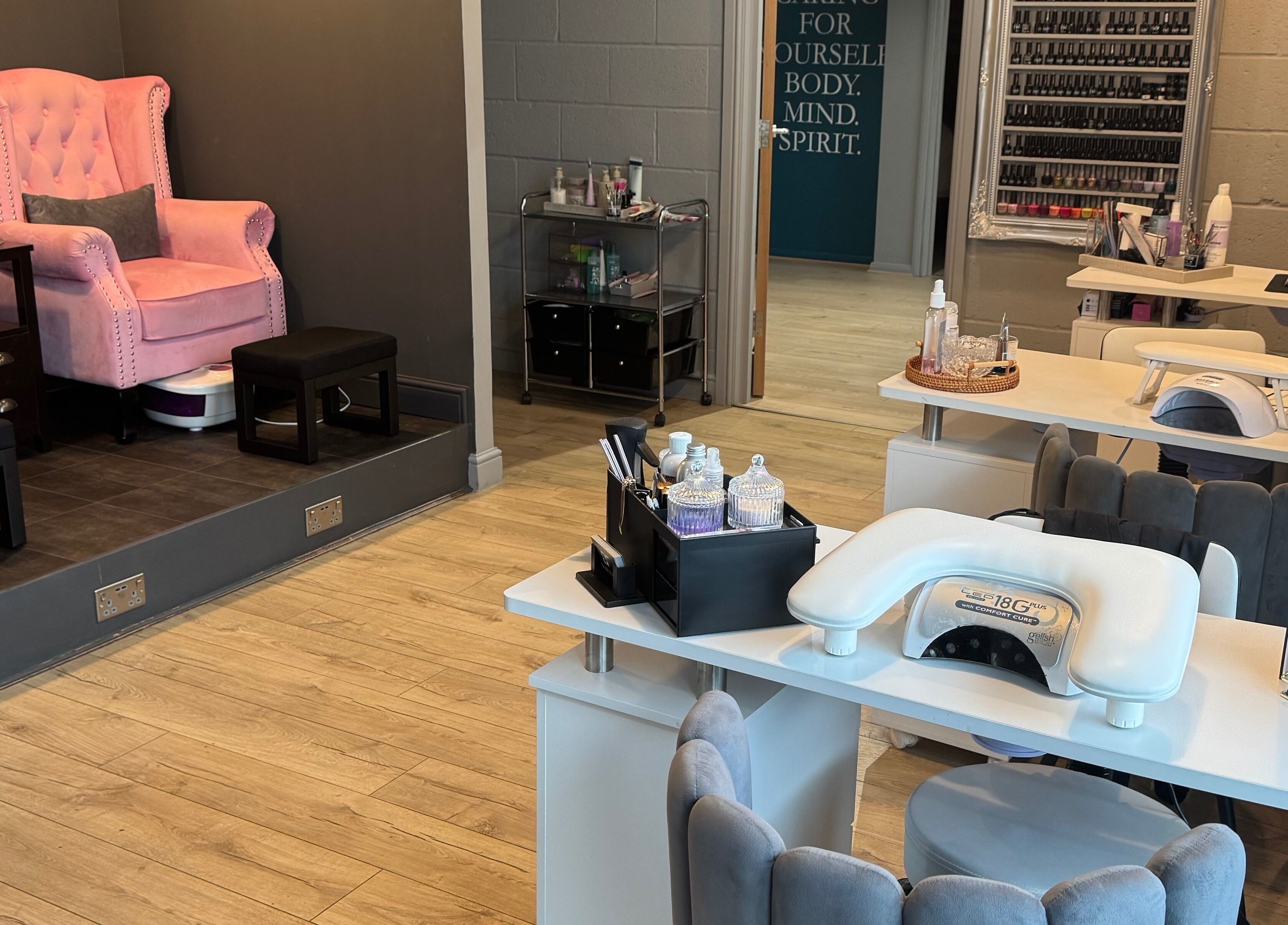 Serenity on Priors & Serenity Beauty in Weldon Corby, England. Elegant pink chairs and nail salon setup.