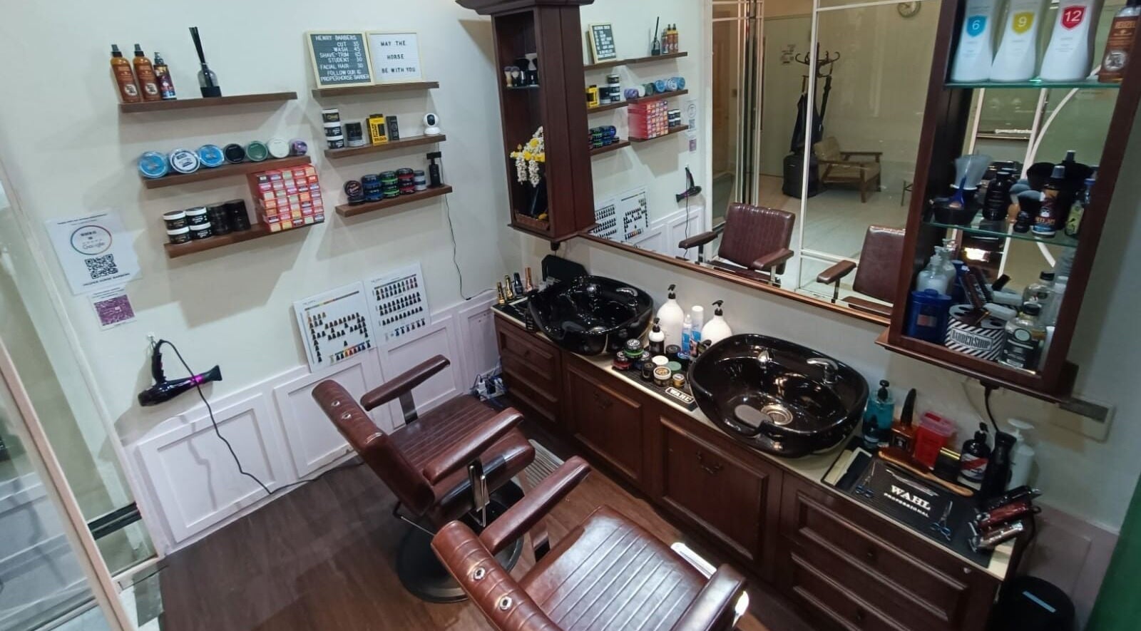 Interior of Proper Horse Barber Shop, featuring vintage chairs and grooming products in Singapore, Singapore, SG.
