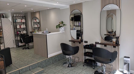 Modern salon interior at Hair Necessities, Newton Abbot, United Kingdom, GB with stylish decor and mirrors.