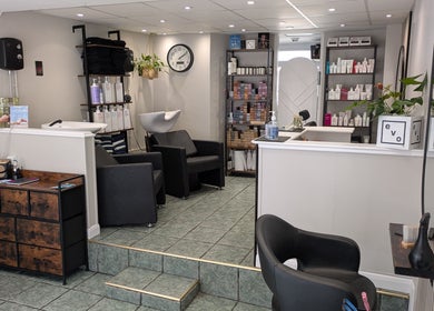 Elegant interior of Hair Necessities in Newton Abbot, United Kingdom, GB with modern decor and beauty products.