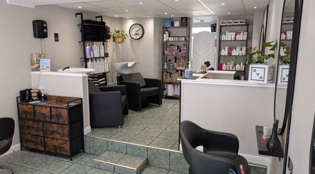 Elegant interior of Hair Necessities in Newton Abbot, United Kingdom, GB with modern decor and beauty products.