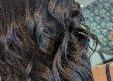 Beautiful curled hair styled at Hair Necessities, Newton Abbot, United Kingdom, GB.