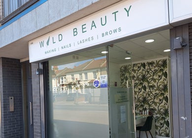 Front entrance of Wild Beauty, a salon in London, England, GB with a stylish botanical decor.
