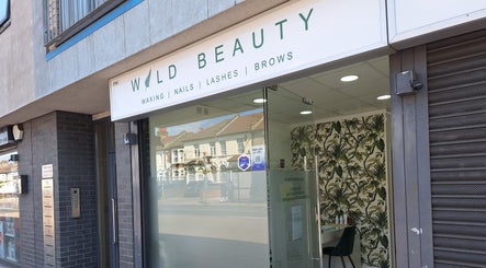 Front entrance of Wild Beauty, a salon in London, England, GB with a stylish botanical decor.