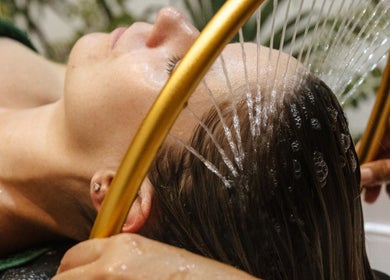 Relaxing hair rinse at Wild Beauty, London, England, GB. Experience luxurious beauty and wellness treatments.