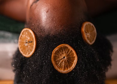 A calming spa treatment at Wild Beauty, London, England, GB with citrus slices on hair.