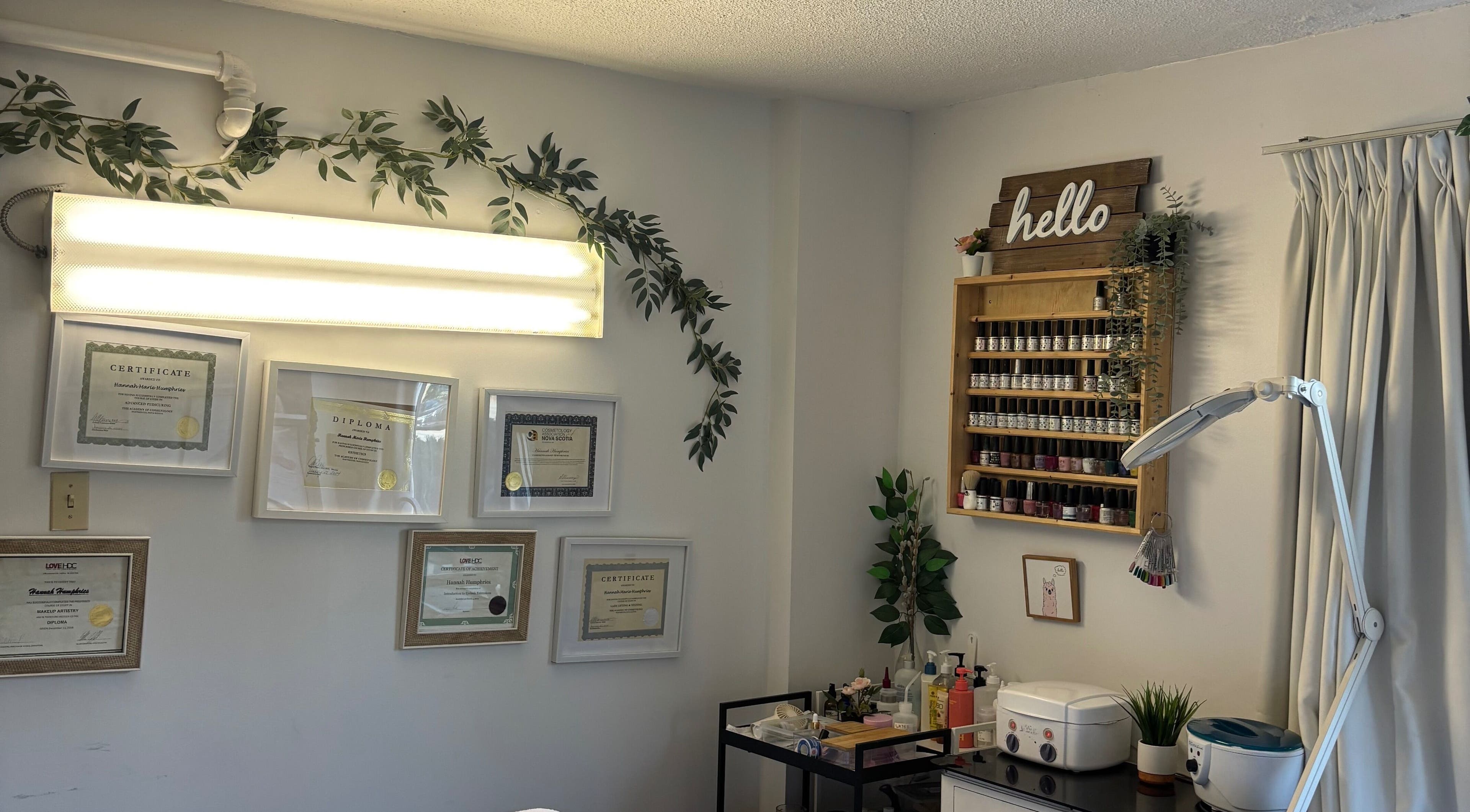 Certificates and nail polish display at EXTRAORDINARY BEAUTY ROOM, Halifax, Nova Scotia, CA.