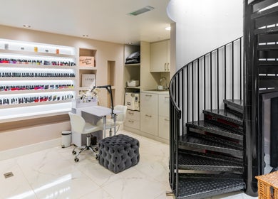 Modern nail salon at Shique London, located in London, England, GB, featuring elegant interior and spiral staircase.
