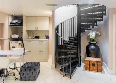 Sophisticated salon corner with sleek spiral staircase at Shique London, London, England, GB.