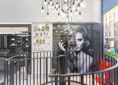 Modern interior of Shique London salon with chic decor and products on display, London, England, GB.