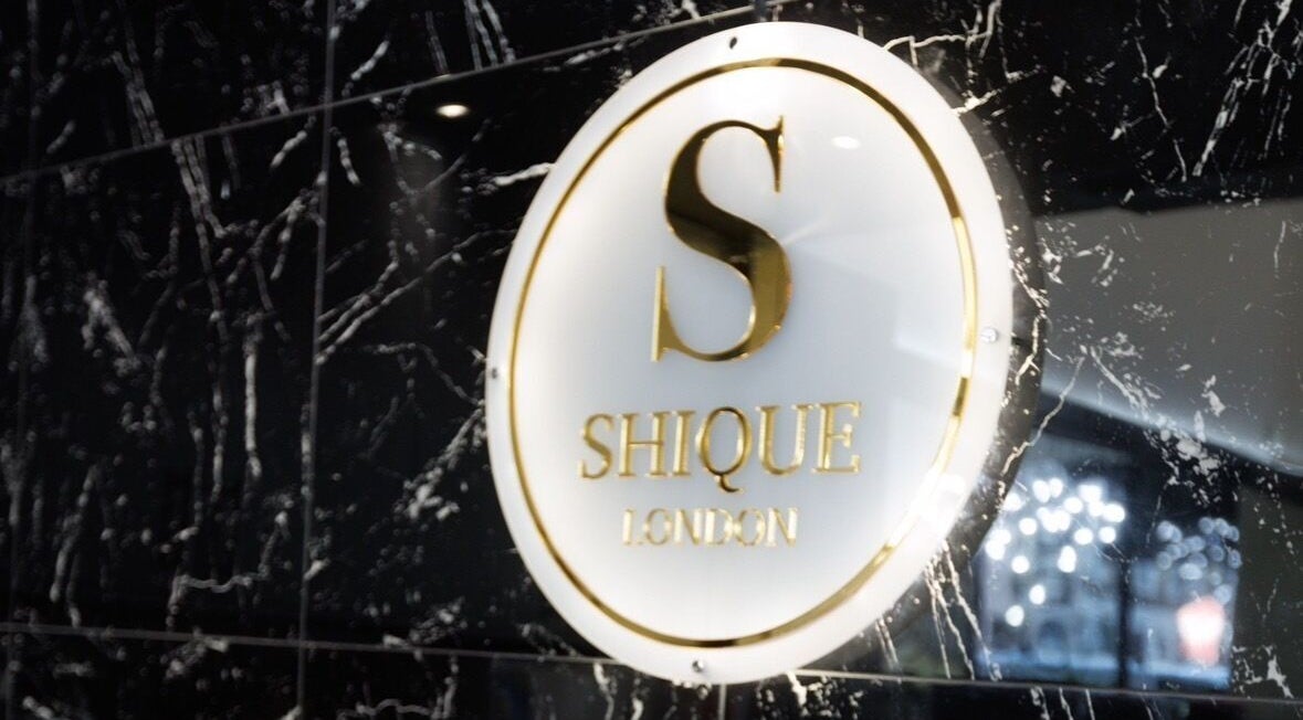 Stylish wall sign at Shique London, a beauty venue in London, England, GB.