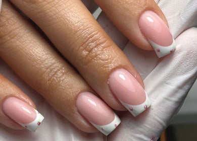 Elegant nail art at The Gellab, Wath Upon Dearne, England, GB. Beautiful pink manicure with floral tips.
