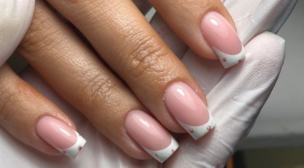 Elegant nail art at The Gellab, Wath Upon Dearne, England, GB. Beautiful pink manicure with floral tips.