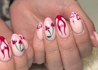 Elegant nail art with red accents at The Gellab, Wath Upon Dearne, England, GB.