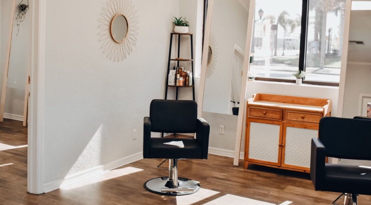Modern styling chair at Highs & Lows Hair Studio in Fort Pierce, Florida, US offers a stylish haircut experience.