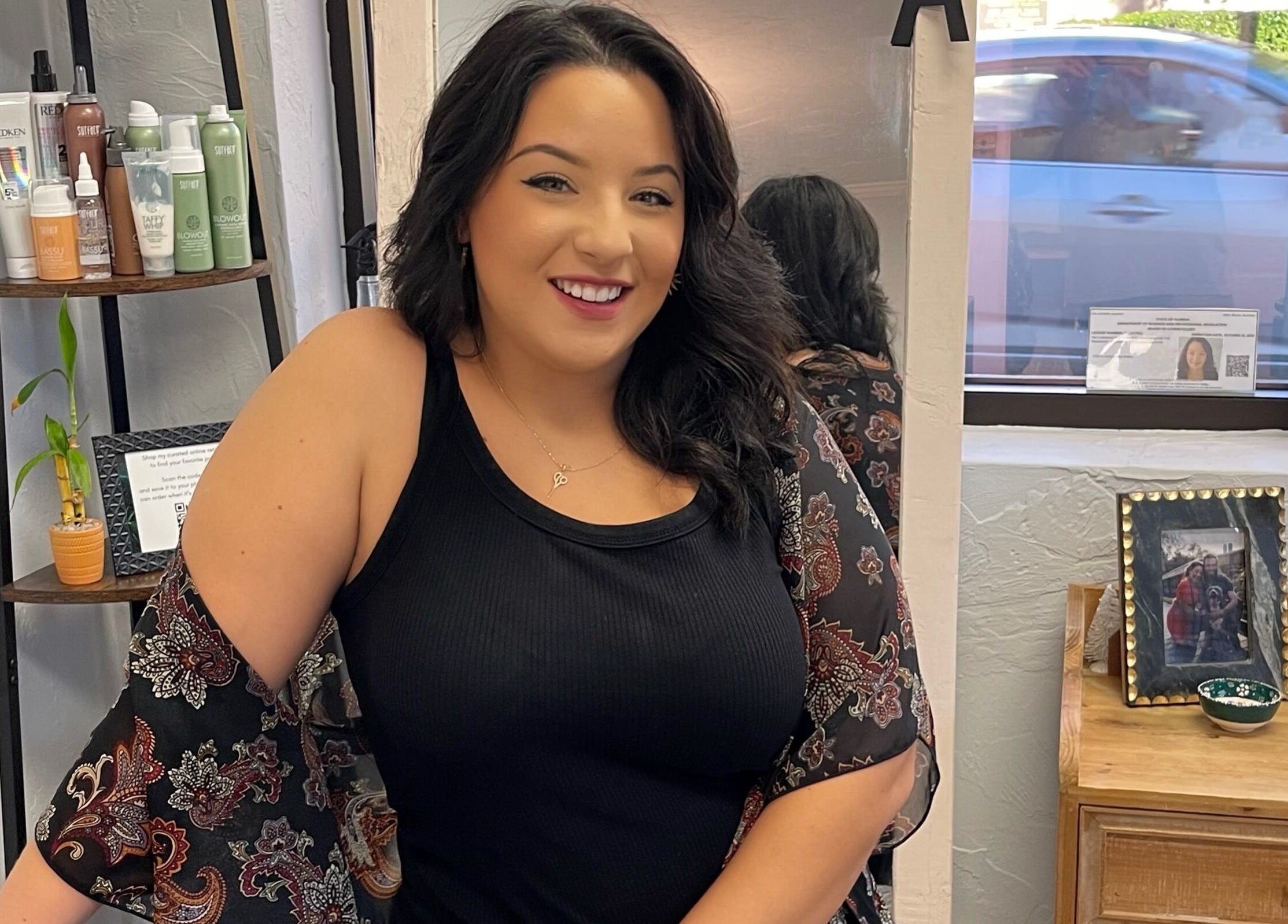 Stylist at Highs & Lows Hair Studio in Fort Pierce, Florida, US, showcasing her vibrant workspace.