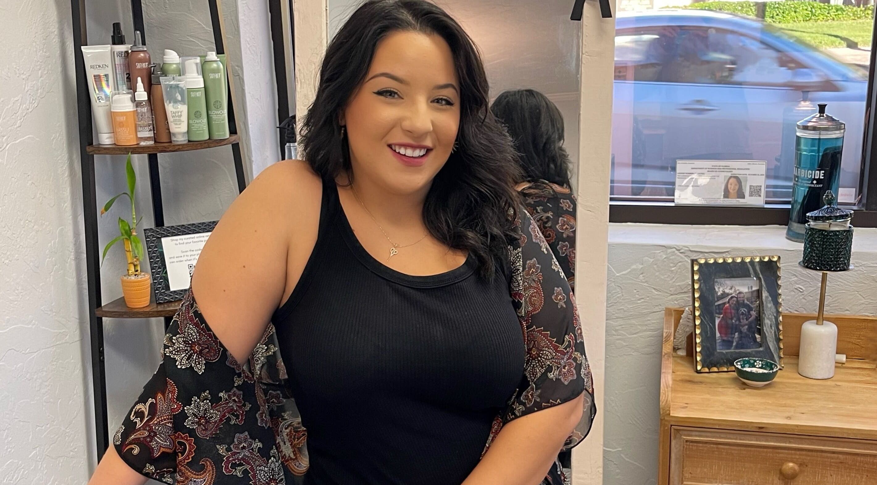 Stylist at Highs & Lows Hair Studio in Fort Pierce, Florida, US, showcasing her vibrant workspace.