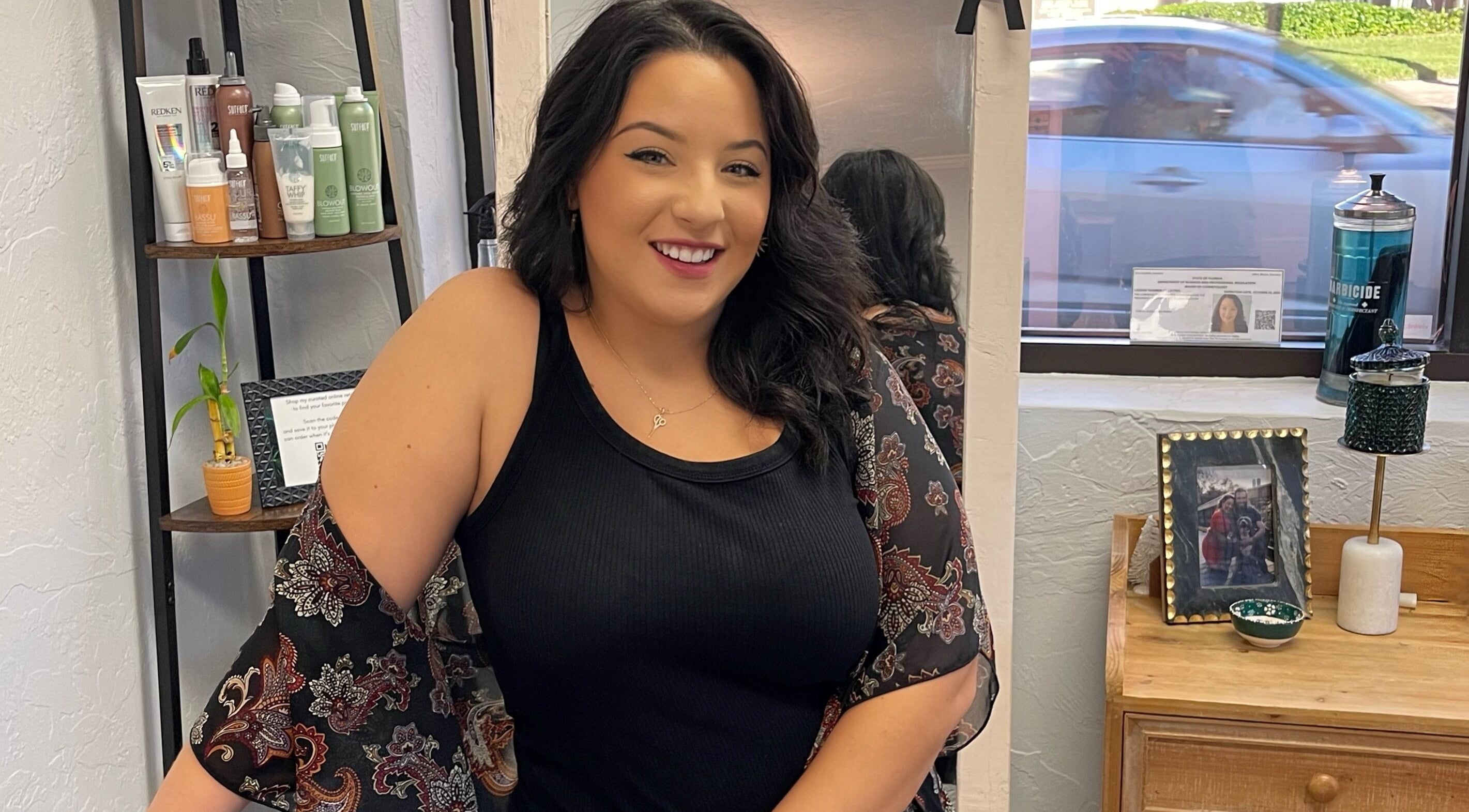 Stylist at Highs & Lows Hair Studio in Fort Pierce, Florida, US, showcasing her vibrant workspace.