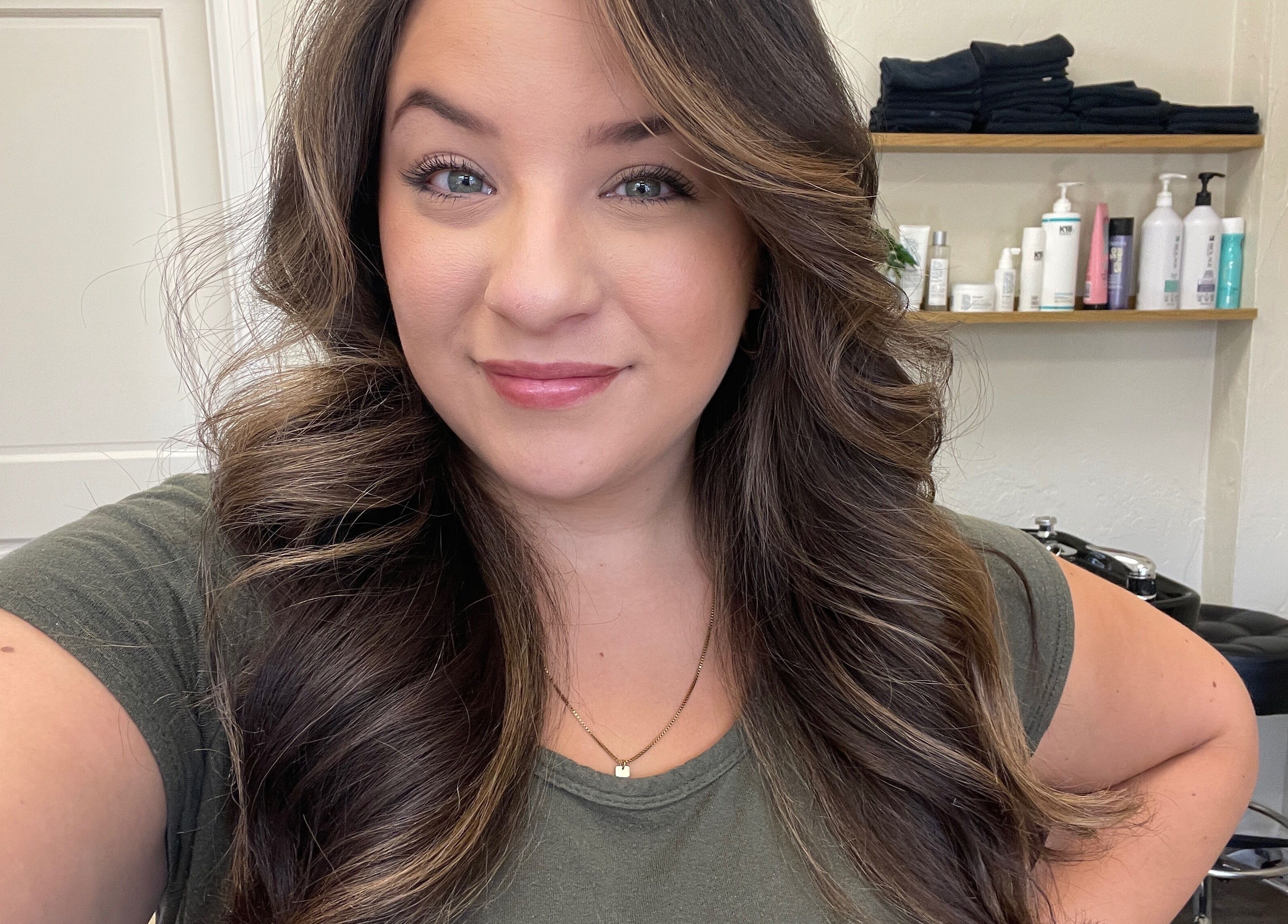 Woman with styled hair at Highs & Lows Hair Studio in Fort Pierce, Florida, US.