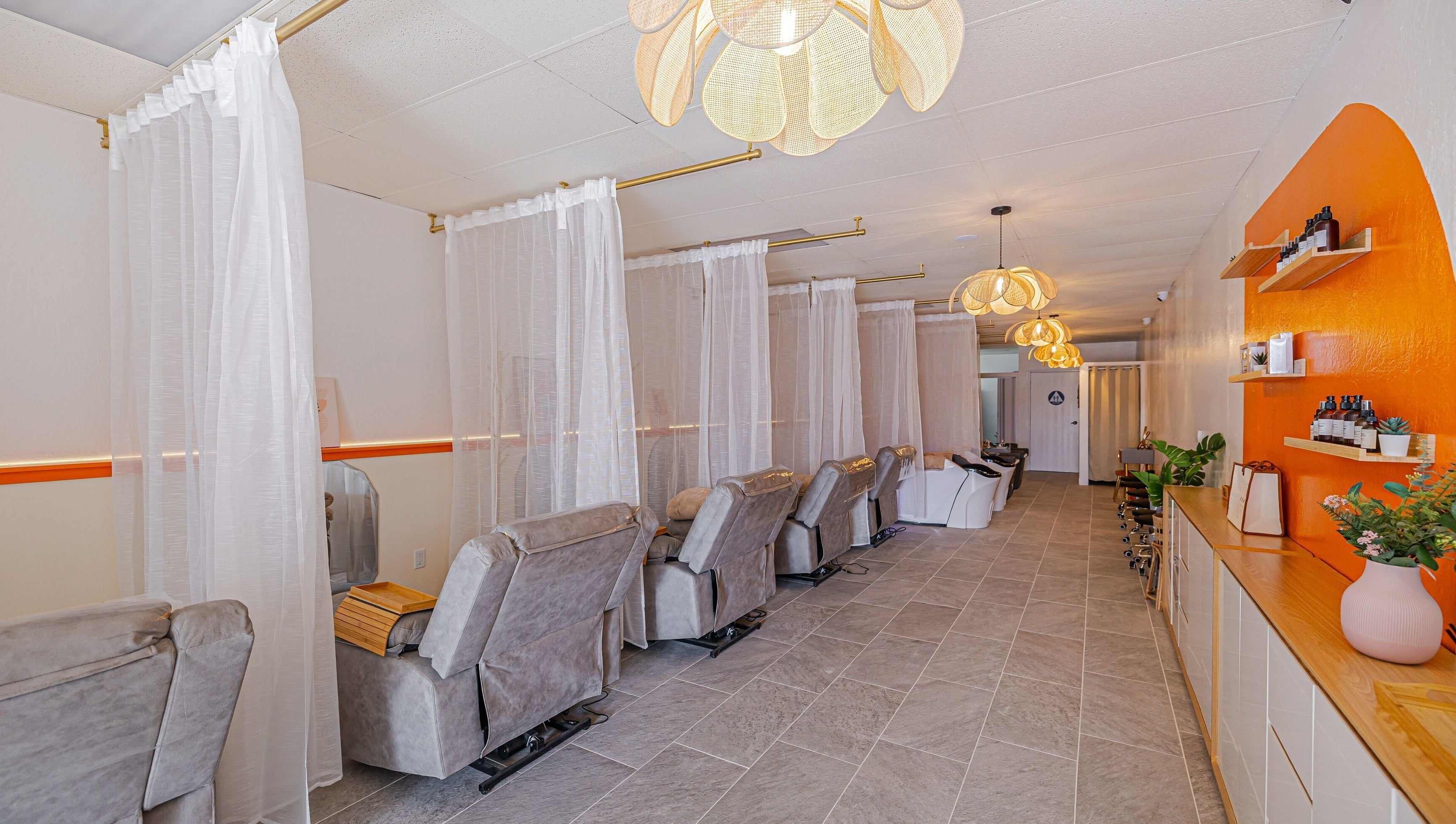 Relaxing spa chairs at The Sense Head + Scalp Spa-South San Jose, San Jose, California, US with warm decor.