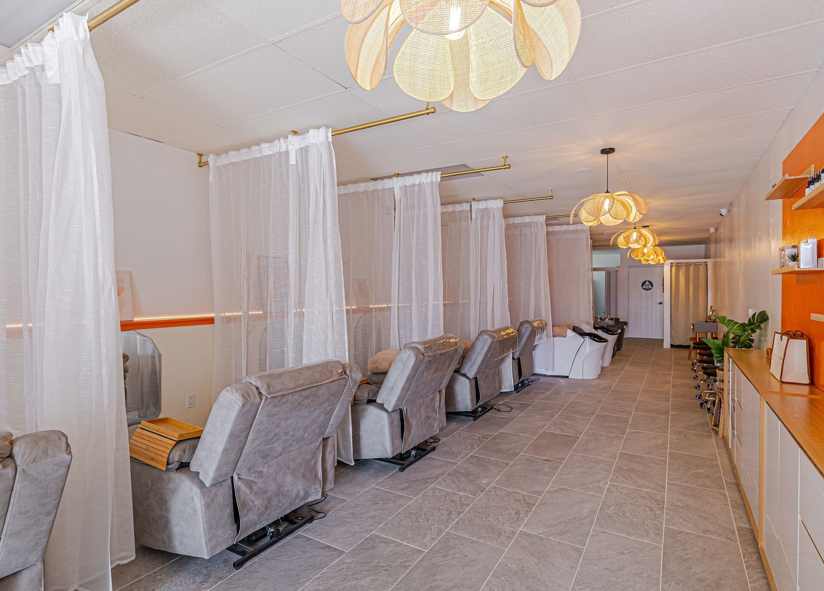 Relaxing spa chairs at The Sense Head + Scalp Spa-South San Jose, San Jose, California, US with warm decor.