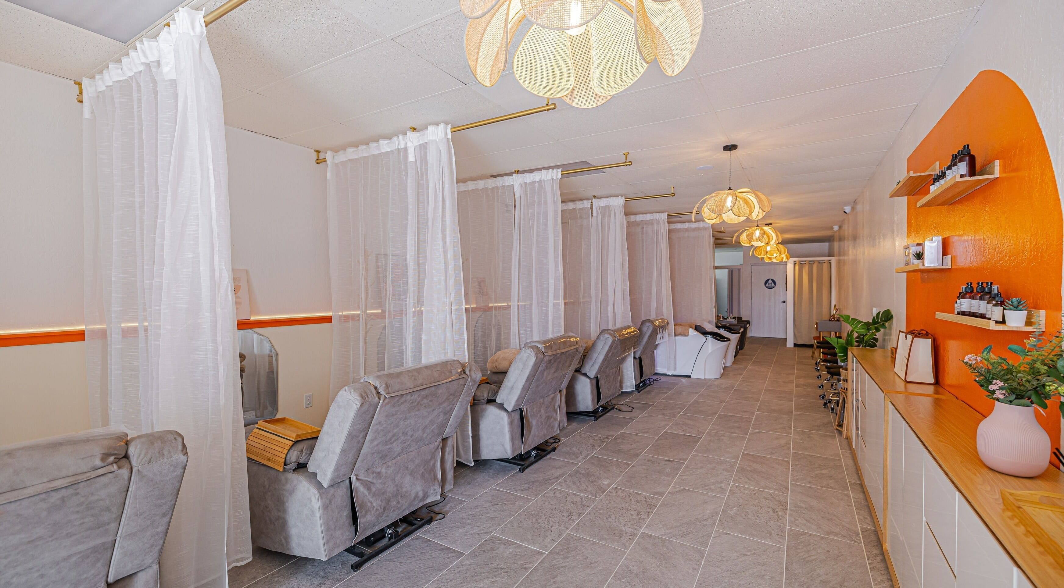 Relaxing spa chairs at The Sense Head + Scalp Spa-South San Jose, San Jose, California, US with warm decor.