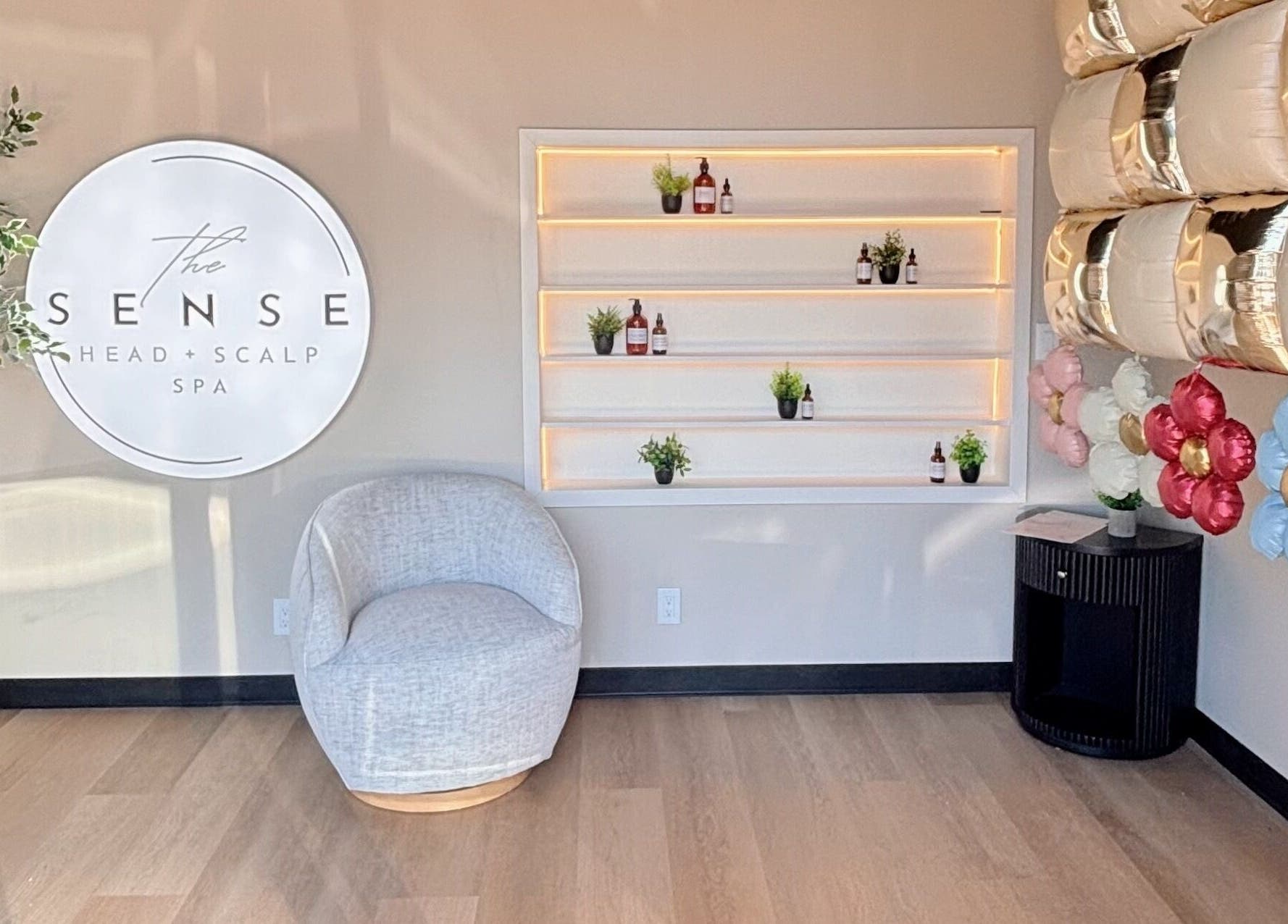 Relaxing corner at The Sense Head + Scalp Spa-Mountain View, California, US with cozy chair and elegant decor.