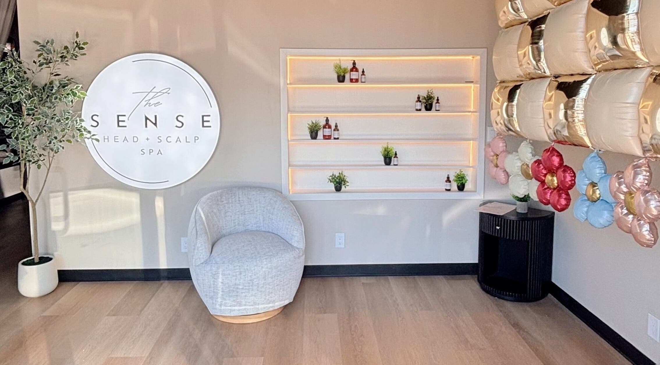 Relaxing corner at The Sense Head + Scalp Spa-Mountain View, California, US with cozy chair and elegant decor.