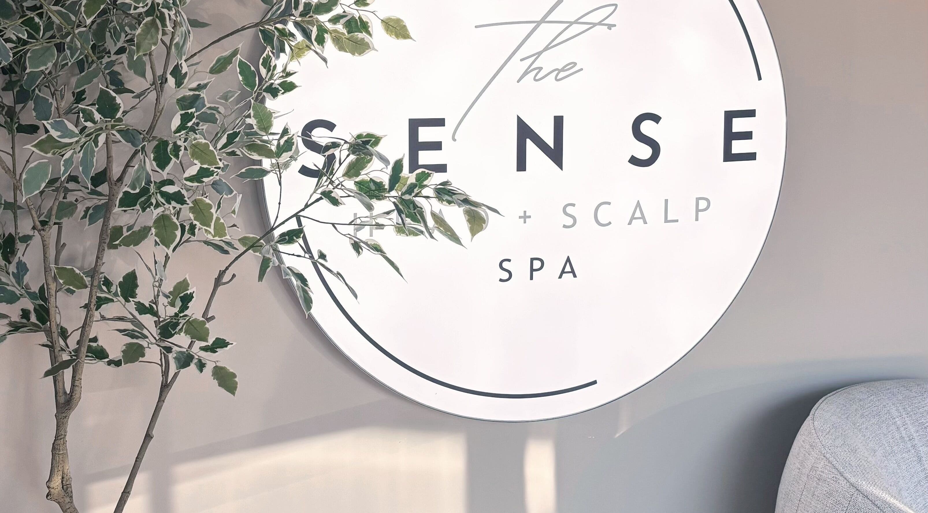 Logo sign of The Sense Head + Scalp Spa-Mountain View surrounded by greenery in Mountain View, California, US.