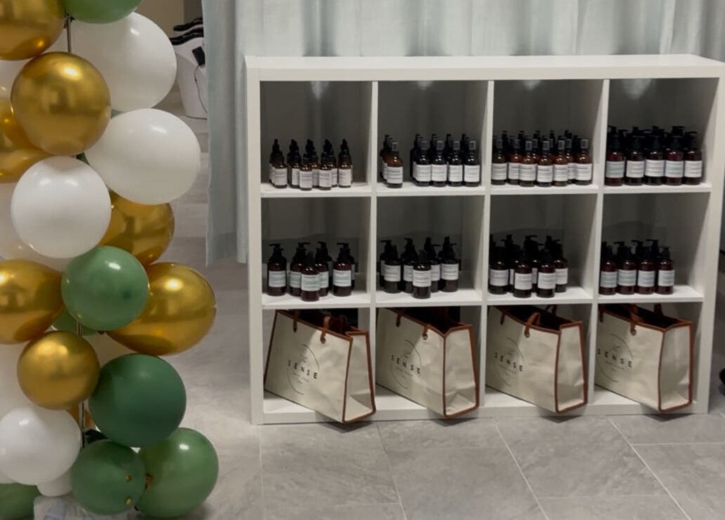 Product display at The Sense Head + Scalp Spa- Fremont, California, US with balloons and items.