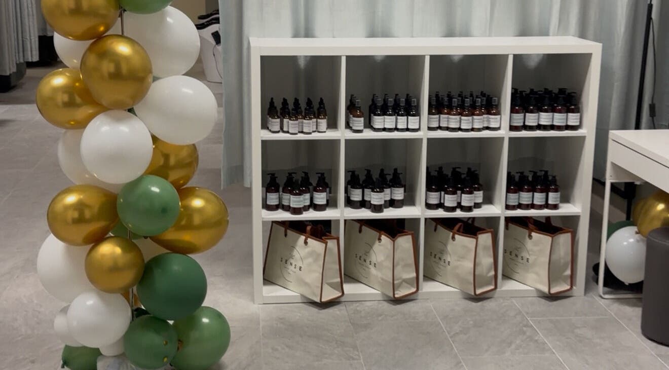 Product display at The Sense Head + Scalp Spa- Fremont, California, US with balloons and items.