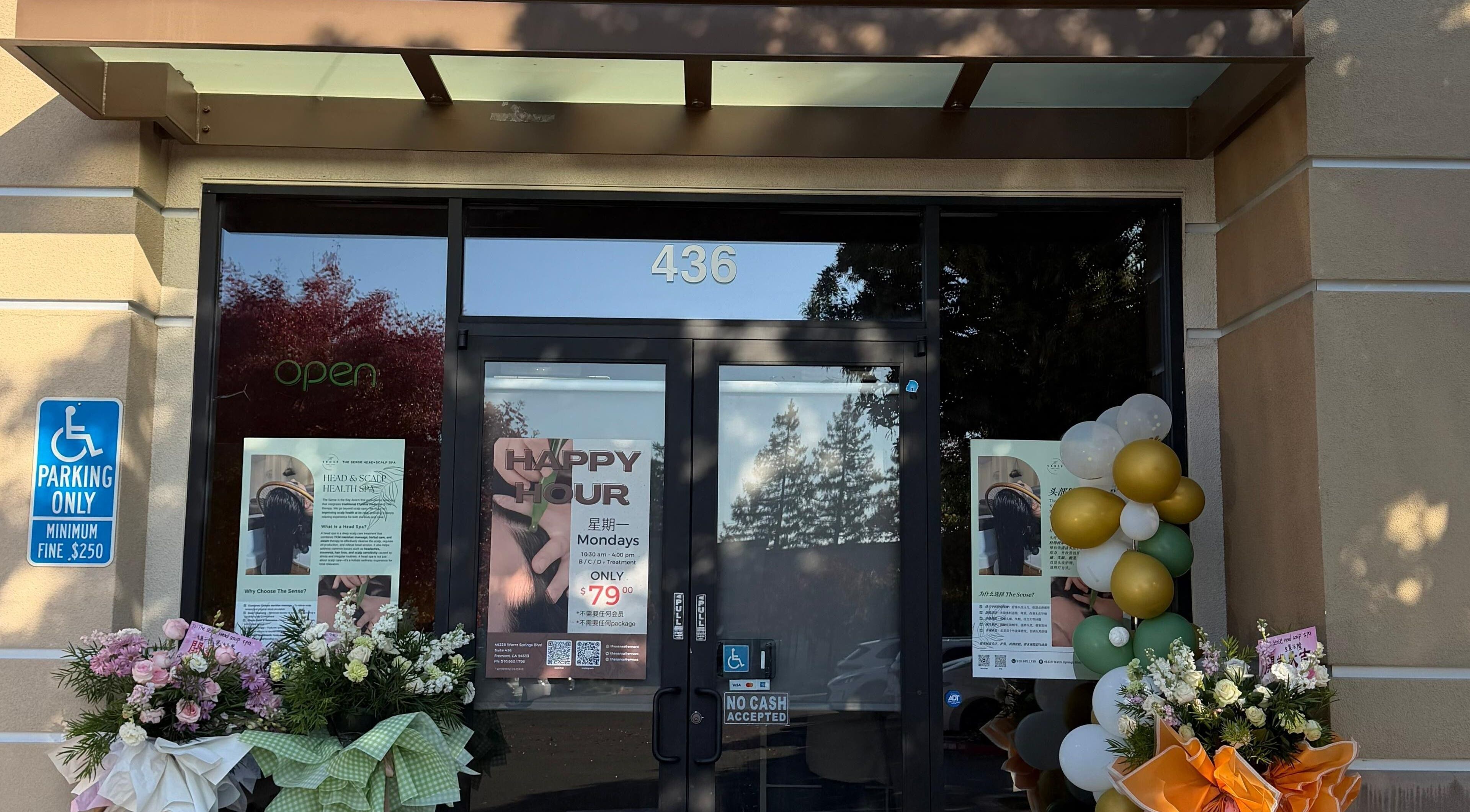 Exterior of The Sense Head + Scalp Spa- Fremont, adorned with flowers and balloons in Fremont, California, US.