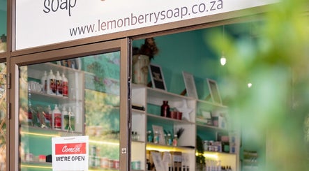 Entrance to Lemon Berry Nail Bar in Randburg, Gauteng, ZA showcasing open sign and product displays.