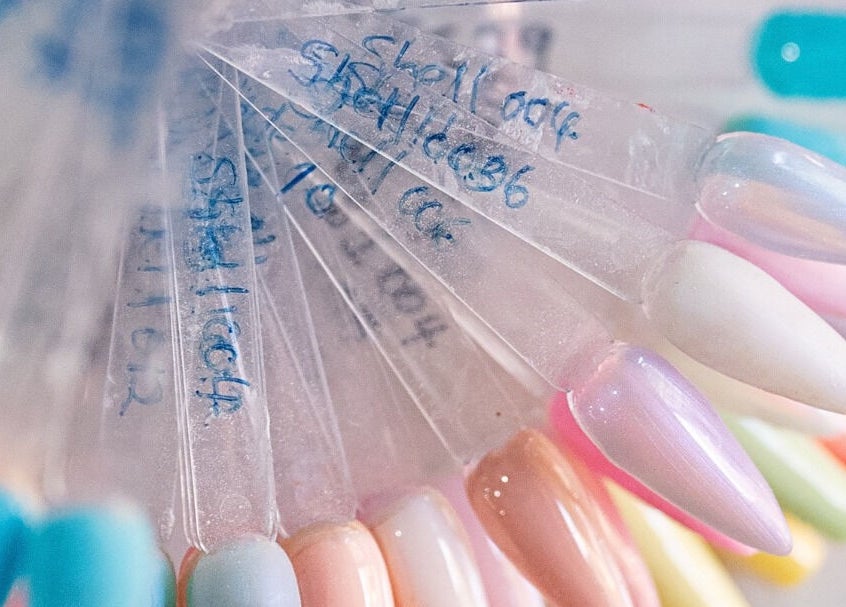Colorful nail polish samples at Lemon Berry Nail Bar, Randburg, Gauteng, ZA showcasing diverse nail hues.