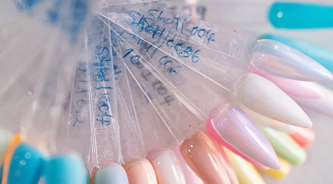 Colorful nail polish samples at Lemon Berry Nail Bar, Randburg, Gauteng, ZA showcasing diverse nail hues.